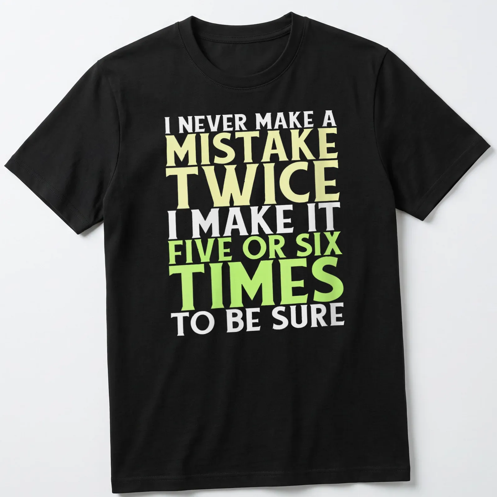 Bold typography t-shirt with funny mistake quote in yellow, green, and white — printed on a unisex t-shirt