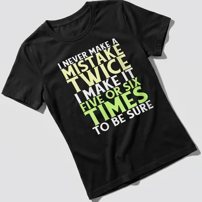 Bold typography t-shirt with funny mistake quote in yellow, green, and white — printed on a women's shirt
