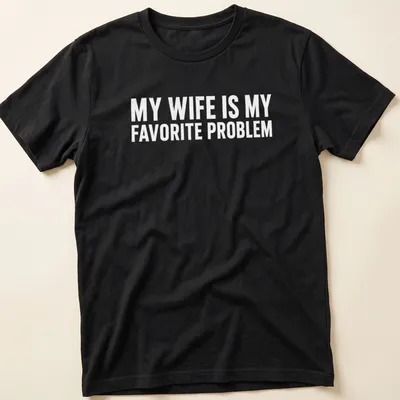 Funny typography shirt with the phrase 'MY WIFE IS MY FAVORITE PROBLEM' in bold text
