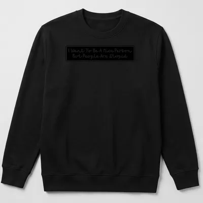 Handwritten t-shirt featuring the quote 'I Want To Be A Nice Person But People Are Stupid' in black and white. — printed on a unisex sweatshirt
