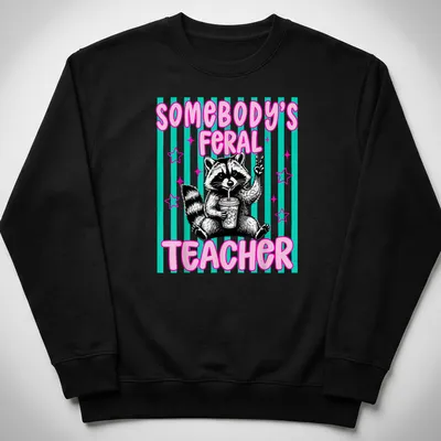 Cartoon raccoon with text 'Somebody's Feral Teacher' in pink, black, teal, and white — printed on a unisex sweatshirt