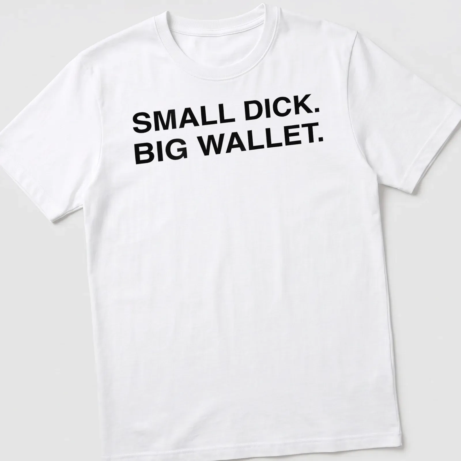 Bold typography shirt with the phrase Small Dick Big Wallet printed in black and white — printed on a unisex t-shirt