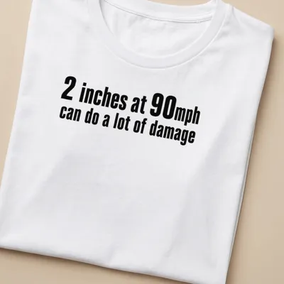 Bold typography shirt with speed humor about inches and mph — printed on a women's shirt