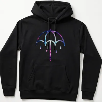 Illustration of a purple umbrella on a cosmic galaxy background in purple, blue, pink, and white — printed on a unisex hoodie