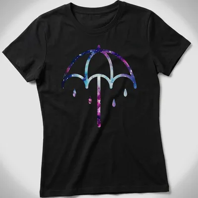 Illustration of a purple umbrella on a cosmic galaxy background in purple, blue, pink, and white — printed on a women's shirt