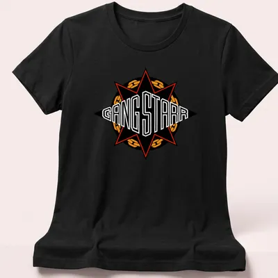 Bold graphic of the Gang Starr emblem with the text GANG STARR in black, red, and orange — printed on a women's shirt
