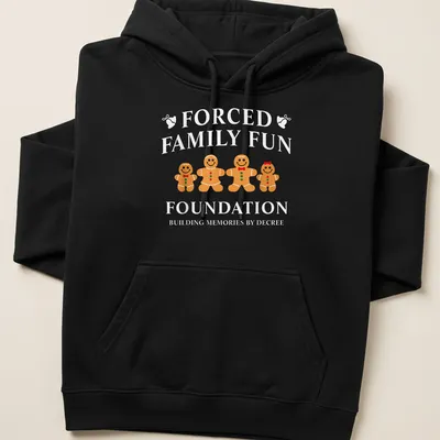 Playful gingerbread cookies illustration with humorous text about family fun — printed on a unisex hoodie