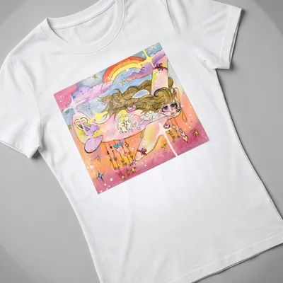 Whimsical watercolor print of a girl flying with a white plane and rainbow — printed on a women's shirt