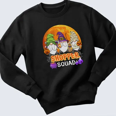 Cartoon gnomes surrounding the word 'SHOPPER' in vibrant Halloween colors — printed on a unisex sweatshirt