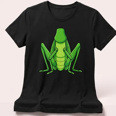 Cartoon grasshopper graphic in green on a Halloween-themed — printed on a women's shirt