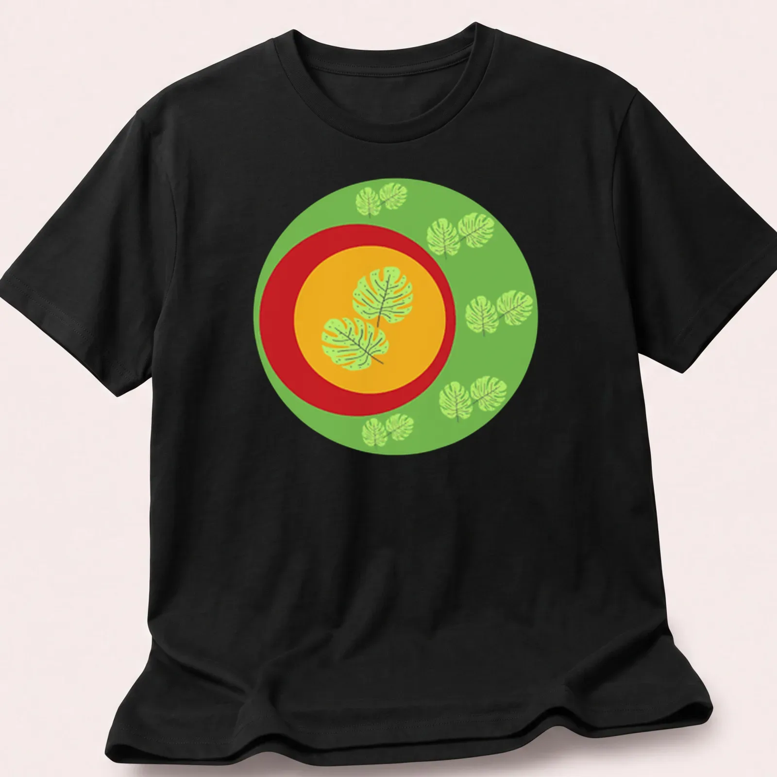 Flat design t-shirt featuring Monstera leaves in green, yellow, and red — printed on a unisex t-shirt