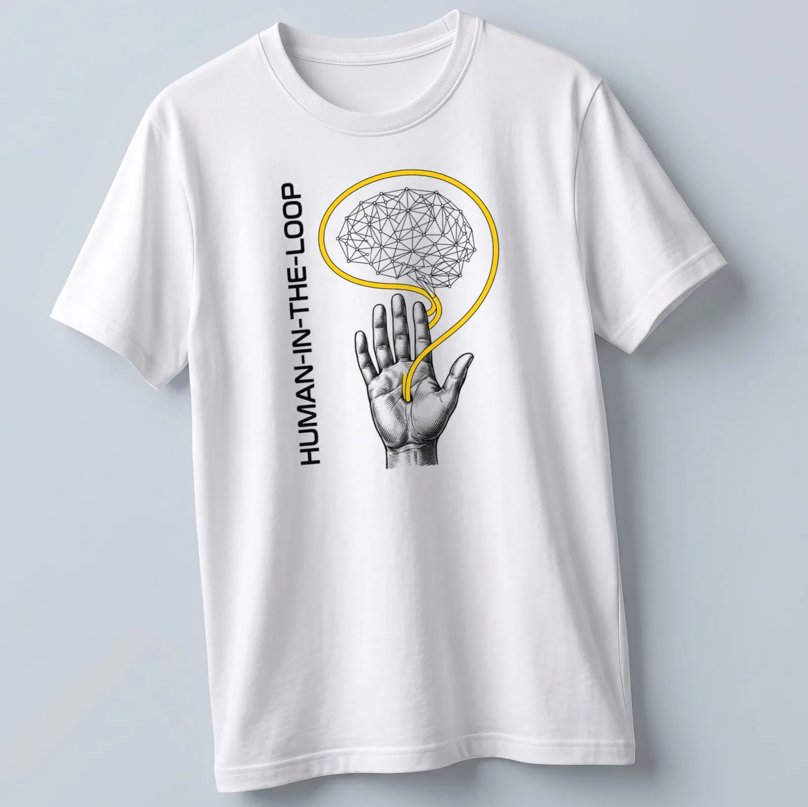Engraved graphic of a hand and neural brain with 'HUMAN-IN-THE-LOOP' text — printed on a unisex t-shirt