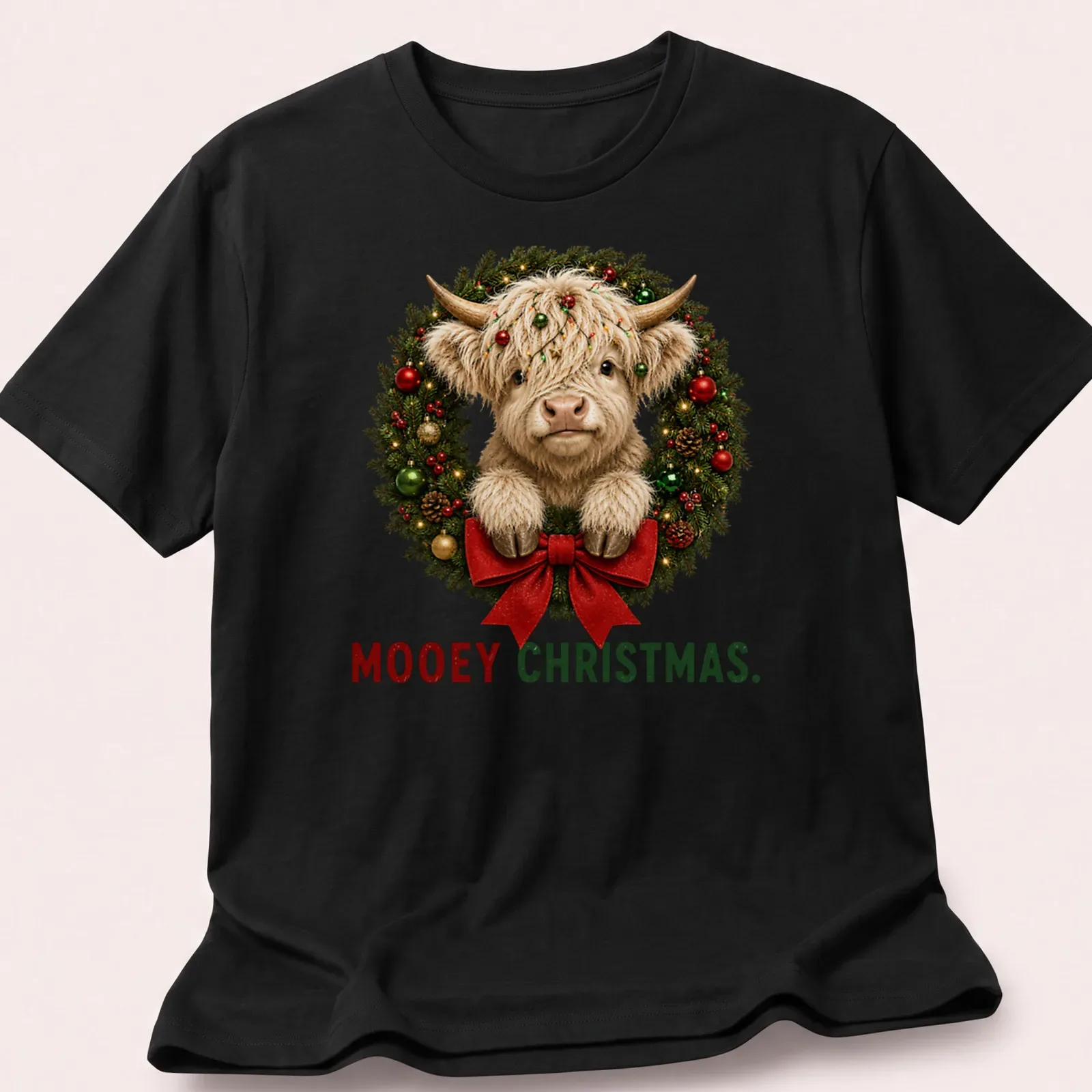 Realistic Highland cow in a holiday wreath with Mooey Christmas text — printed on a unisex t-shirt