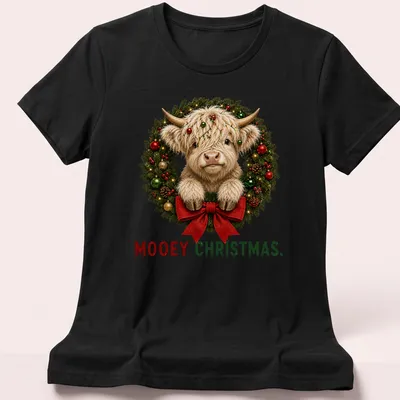 Realistic Highland cow in a holiday wreath with Mooey Christmas text — printed on a women's shirt