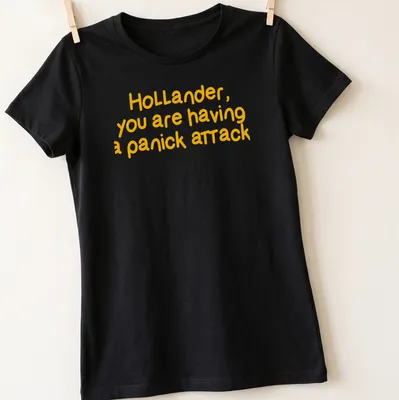 Bold typography t-shirt with humorous text about a panic attack — printed on a women's shirt