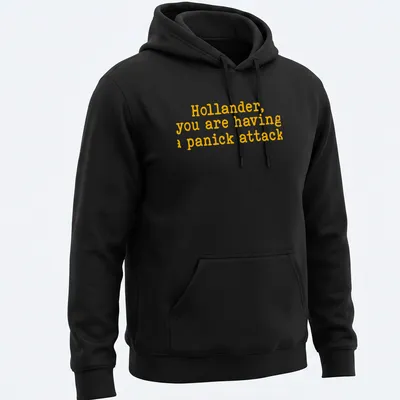 Bold yellow text on a t-shirt reads 'Hollander, you are having a panick attack' in playful typography — printed on a unisex hoodie