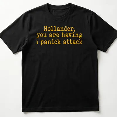 Bold yellow text on a t-shirt reads 'Hollander, you are having a panick attack' in playful typography