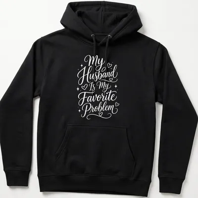 Script typography shirt with the phrase My Husband Is My Favorite Problem in white — printed on a unisex hoodie