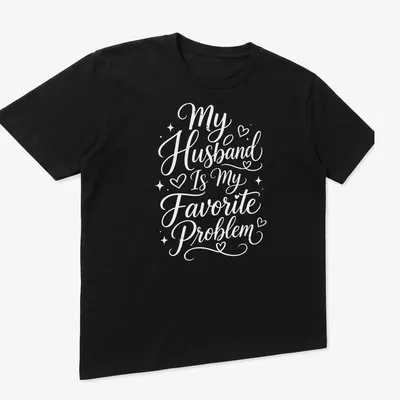 Script typography shirt with the phrase My Husband Is My Favorite Problem in white — printed on a unisex t-shirt (angled view)