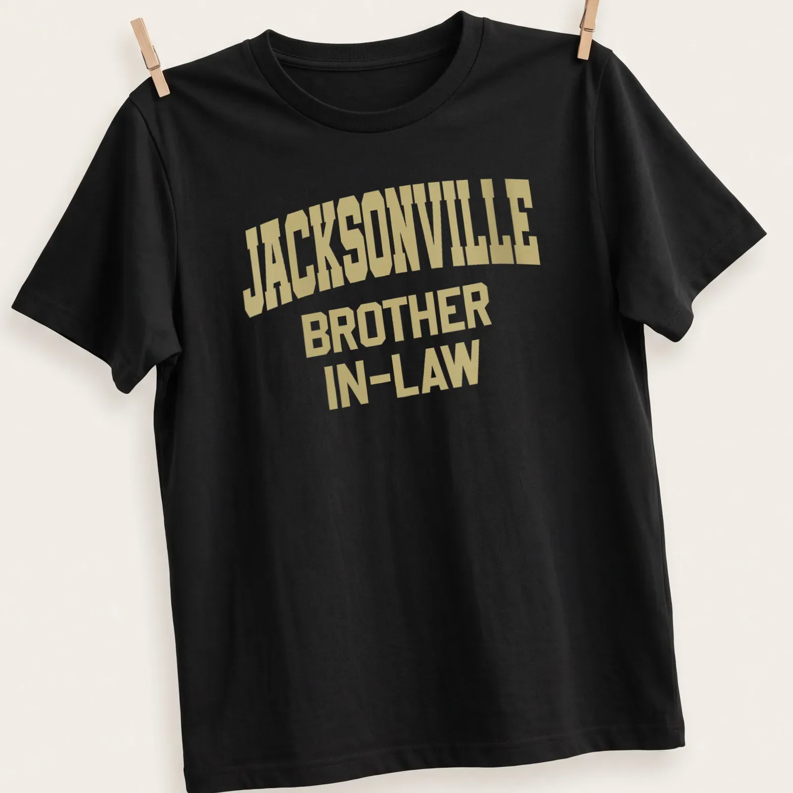 Bold collegiate Jacksonville Brother In-Law t-shirt in gold lettering — printed on a unisex t-shirt