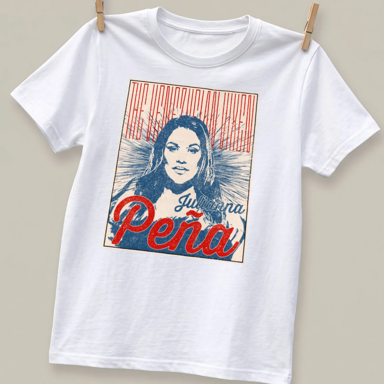 Vintage poster style t-shirt featuring Julianna Peña as 'The Venezuelan Vixen' in red, blue, and cream — printed on a unisex t-shirt