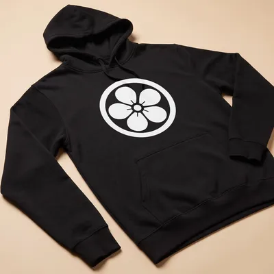 Kamon emblem printed on a T-shirt representing Japanese heritage. — printed on a unisex hoodie
