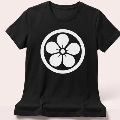 Kamon emblem printed on a T-shirt representing Japanese heritage. — printed on a women's shirt