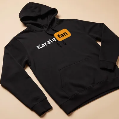 Bold Karate Fan T-Shirt with modern typography in black, orange, and white — printed on a unisex hoodie