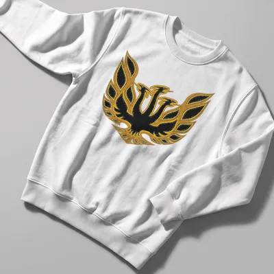 Bold emblem of King Ghidorah in black and gold on a — printed on a unisex sweatshirt