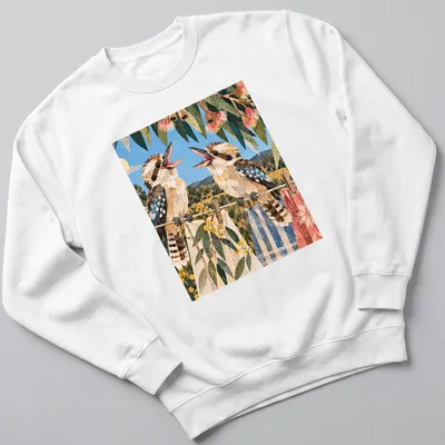 Vintage illustrated t-shirt featuring laughing kookaburras in soft colors — printed on a unisex sweatshirt