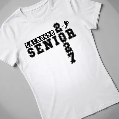 Bold collegiate Lacrosse Senior 2027 t-shirt featuring a lacrosse player in black and white — printed on a women's shirt