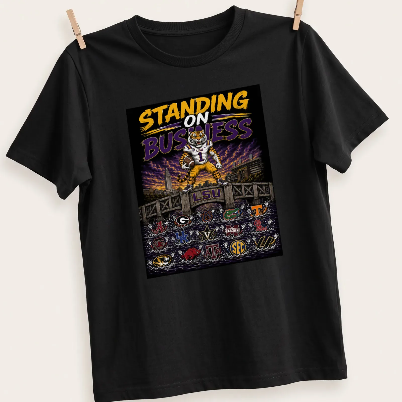 Vibrant illustration featuring LSU Tigers with bold text — printed on a unisex t-shirt