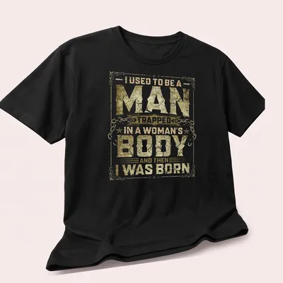 Vintage distressed tee with humorous text about identity in gold and white. — printed on a unisex t-shirt (angled view)