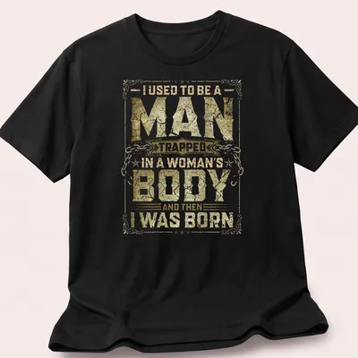 Vintage distressed tee with humorous text about identity in gold and white.