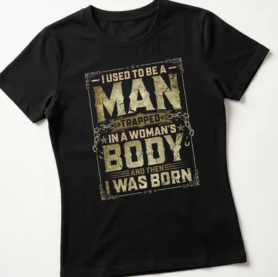 Vintage distressed tee with humorous text about identity in gold and white. — printed on a women's shirt