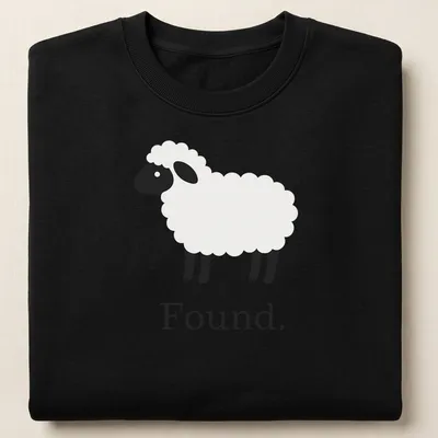 Minimalist sheep graphic with the word 'Found.' in black and white — printed on a unisex sweatshirt