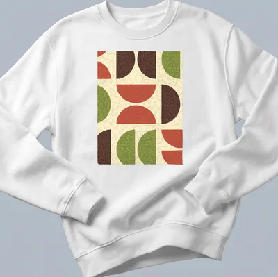 Textured T-shirt featuring geometric shapes in red, green, brown, and beige. — printed on a unisex sweatshirt