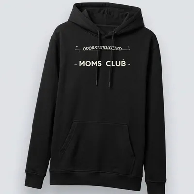Moms Club t-shirt with 'Overstimulated Moms Club' in rounded bubble lettering on a cream background — printed on a unisex hoodie
