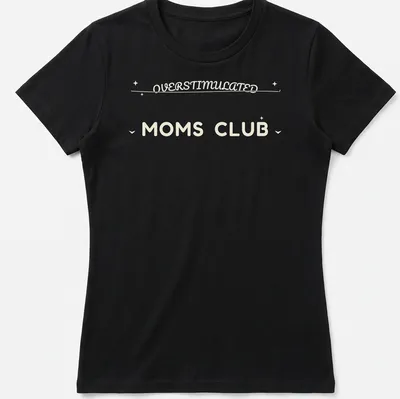 Moms Club t-shirt with 'Overstimulated Moms Club' in rounded bubble lettering on a cream background — printed on a women's shirt