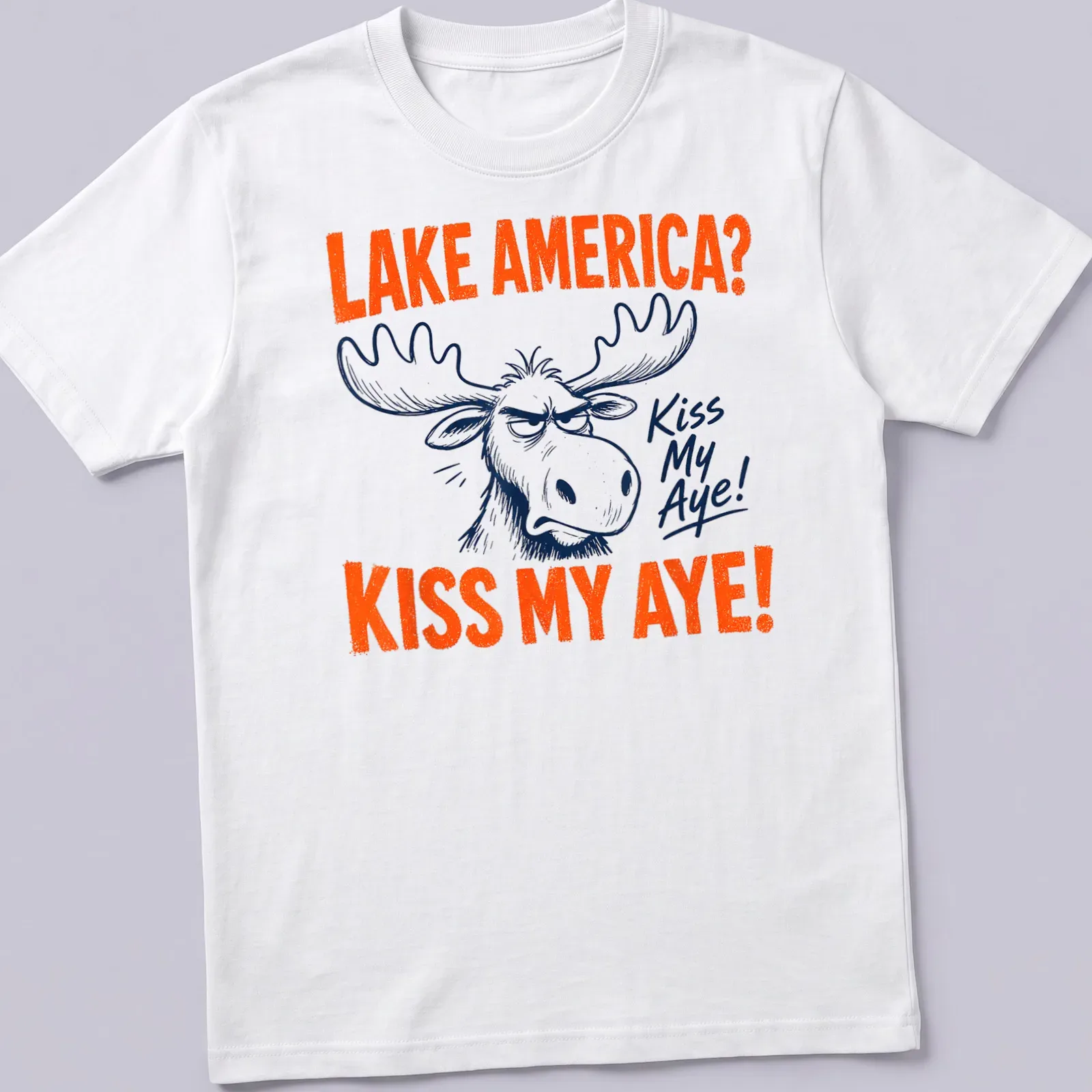 Cartoon moose with text 'LAKE AMERICA? KISS MY AYE!' in vibrant colors — printed on a unisex t-shirt