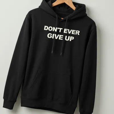 Bold typography t-shirt with the motivational phrase Don't Ever Give Up in white. — printed on a unisex hoodie