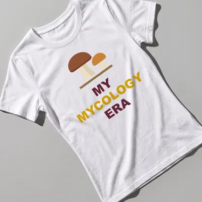 Minimalist mushroom graphic t-shirt featuring earthy tones with text above — printed on a women's shirt