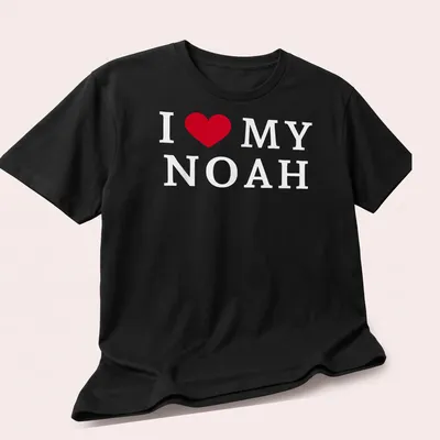 Red and white typography t-shirt with I ❤️ MY NOAH — printed on a unisex t-shirt (angled view)