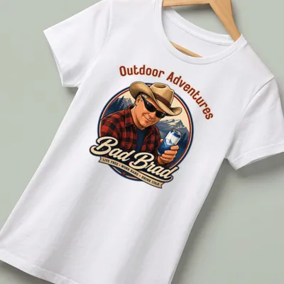 Vintage T-shirt featuring a man in a cowboy hat with outdoor adventure text — printed on a women's shirt