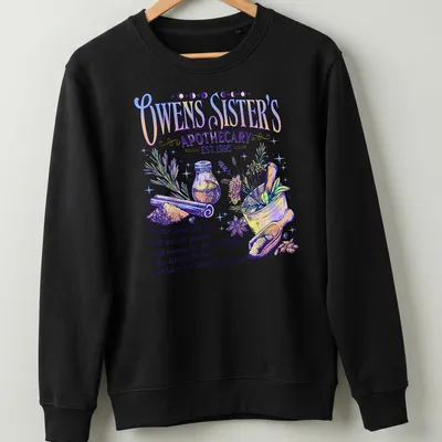 Whimsical illustration of herbs and spices with colorful text about luck and love — printed on a unisex sweatshirt