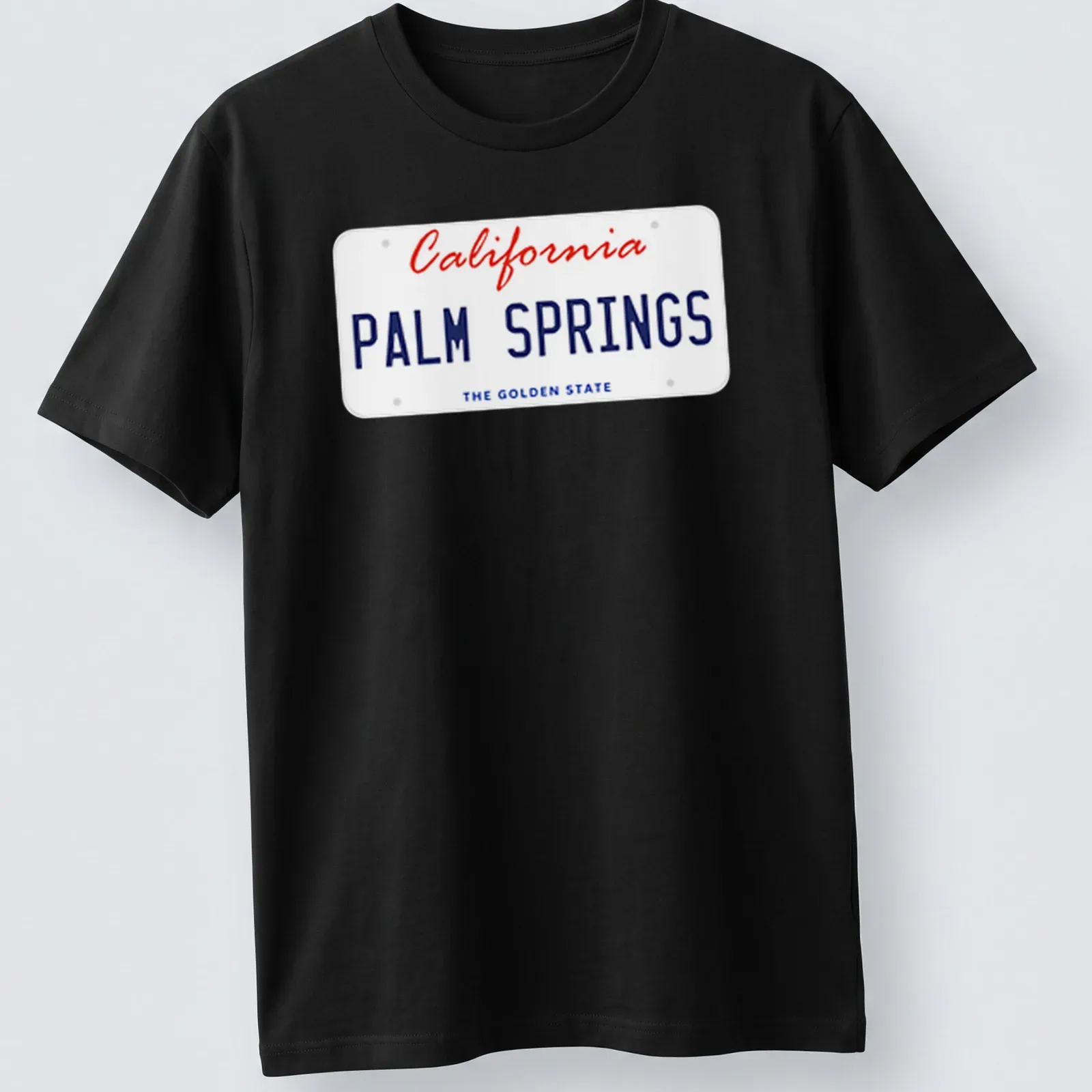 Vintage license plate design featuring Palm Springs, California, in red, blue, and white. — printed on a unisex t-shirt