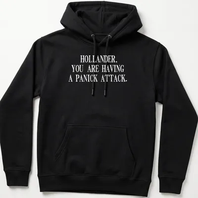 Bold typography t-shirt featuring the quote about panic attacks in black and white. — printed on a unisex hoodie