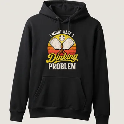Retro distressed t-shirt with pickleball paddles and humorous text about dinking problems — printed on a unisex hoodie