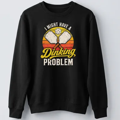Retro distressed t-shirt with pickleball paddles and humorous text about dinking problems — printed on a unisex sweatshirt
