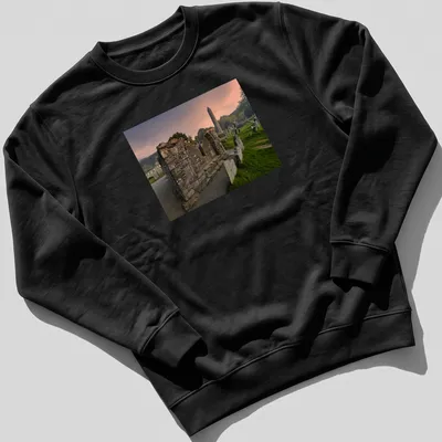 Photographic print of a ruined stone structure and round tower with vivid colors — printed on a unisex sweatshirt